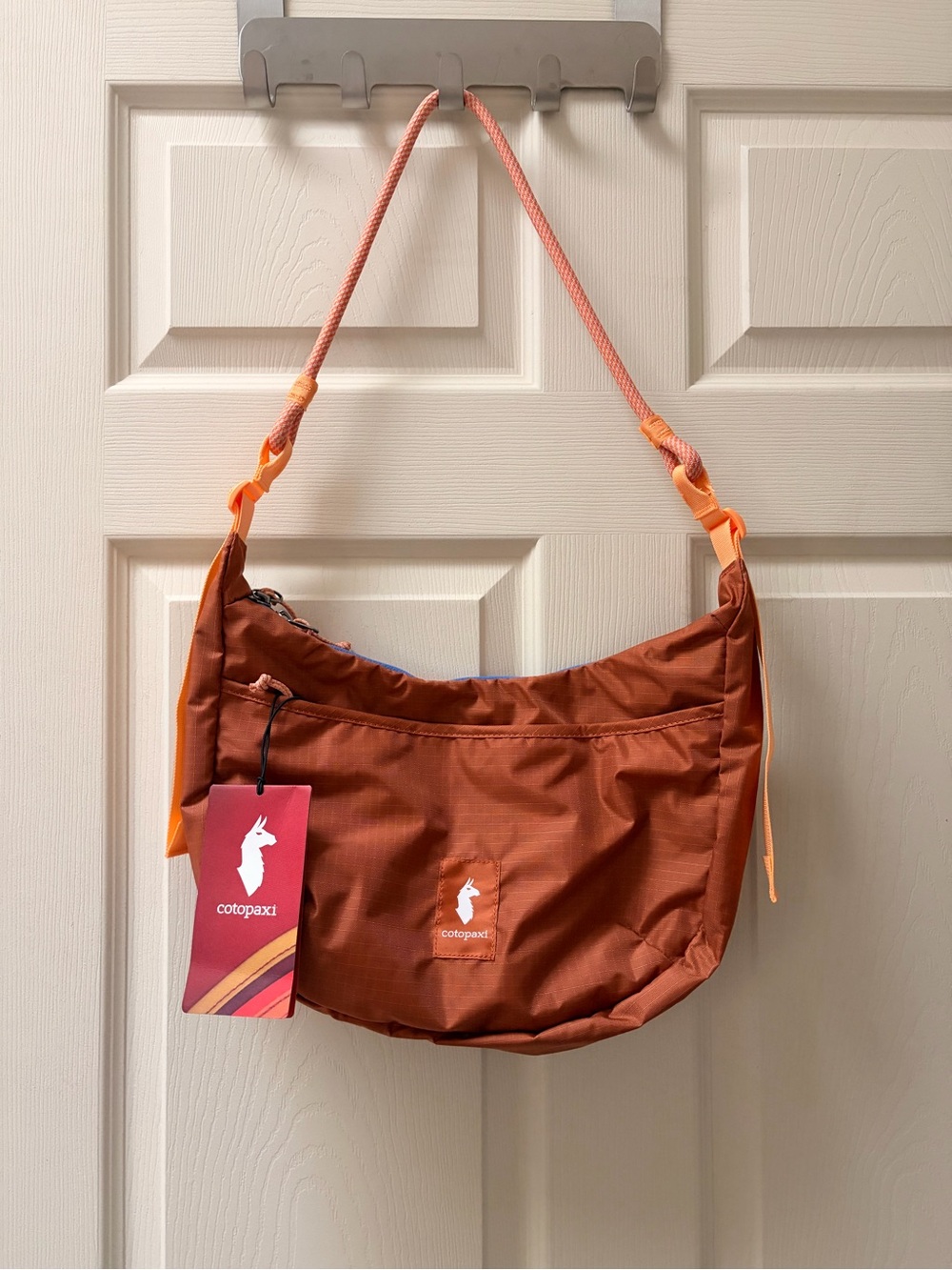 Cotopaxi Trozo 8L Bag - rust orange crossbody shoulder bag with peach strap